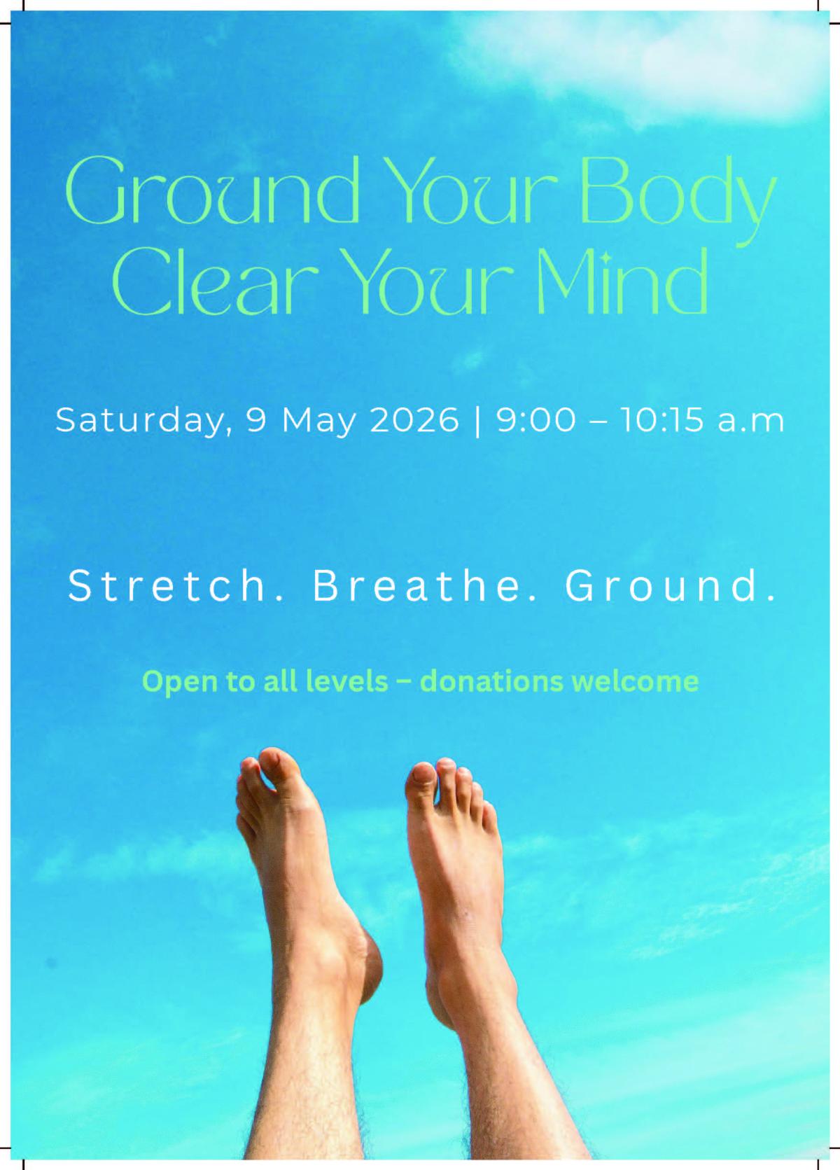 The event poster with bare feet lifted into the blue sky