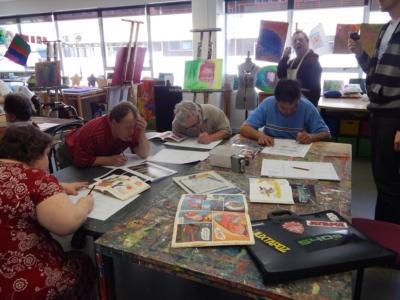 An Image of the Alpha Artists at work drawing.