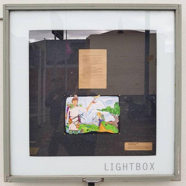 photo of artwork and words in lightbox