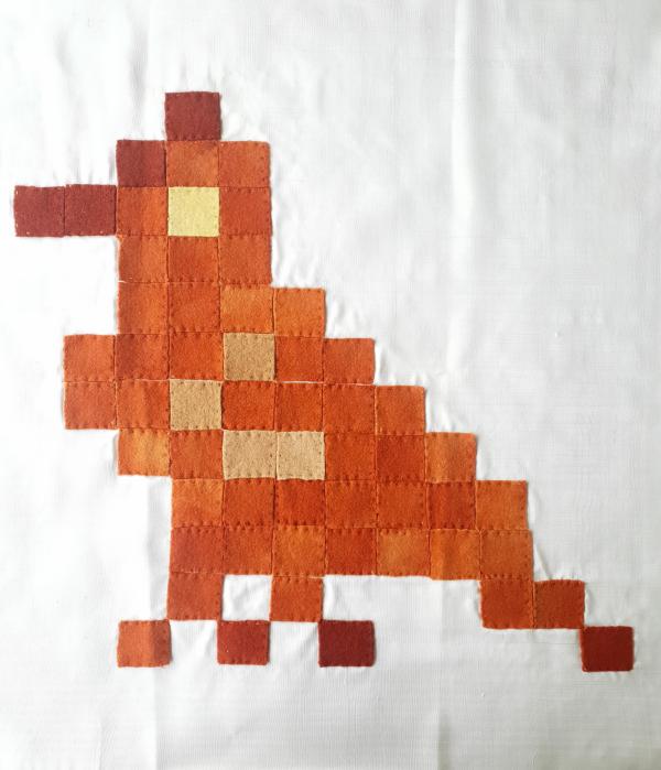Pixallated bird, created from different coloured ribbons that have been hemmed