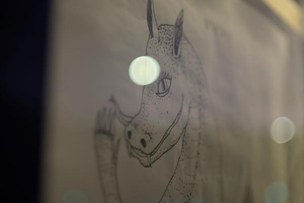 Detail of Tiso Ross artwork with twinkling lights reflected in glass. Photographer Amos Mann.
