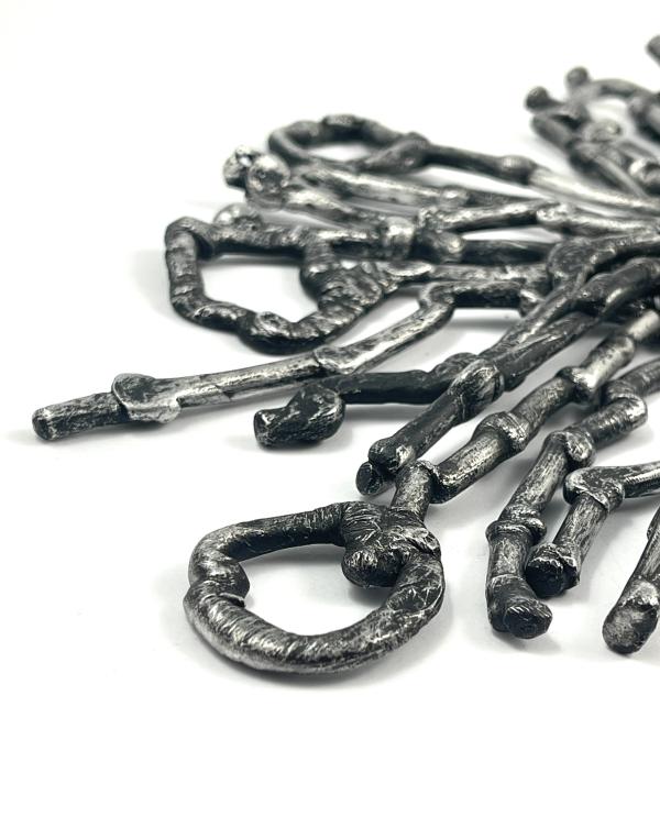 A close-up of an undescript pile of wonky key-like metal creations by Phillipa Gee 