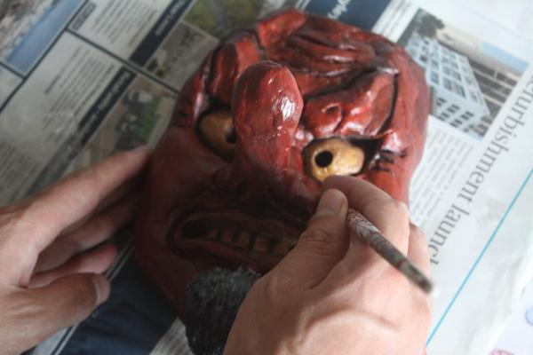 Michael Allread working on a Japanese mask