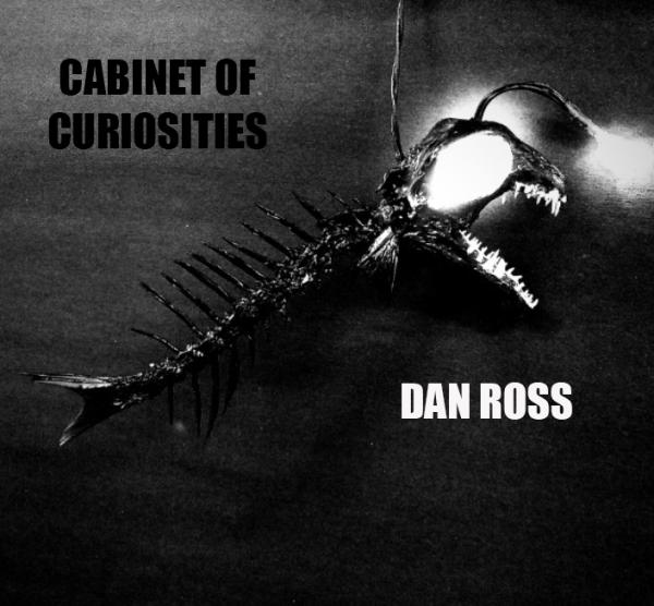 Moody poster for Dan Ross exhibition "Cabinet of Curiosities". Features a fearsome angler fish skeleton with illuminated eye sockets.