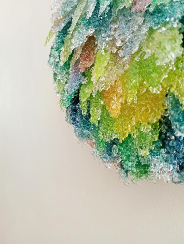 Glass art by Dirt Child Design. A ball of crystal forms, clumped in stalactites.