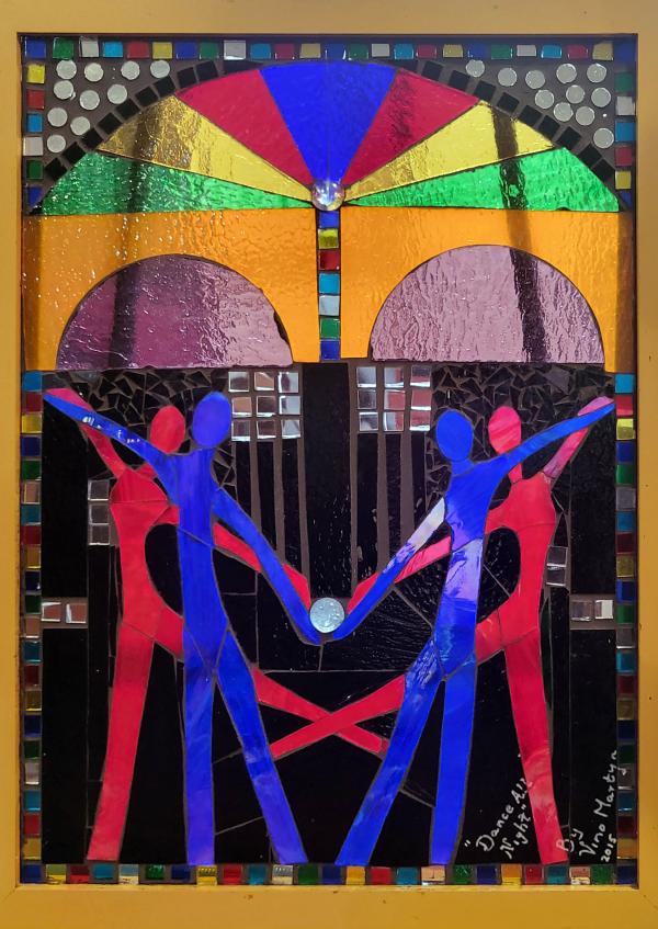 "Dance All Night" a stained glass art piece by Vino Martyn. Human figures in jewel toned red and blue dance gracefully in front of an abstract arch.