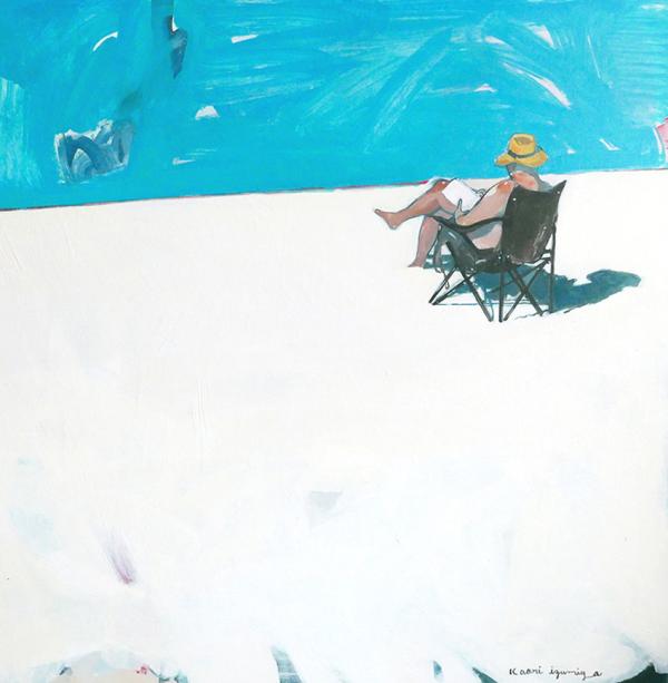 Image of man wearing a hat seated next to water