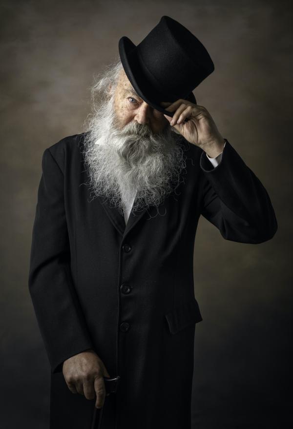 Portrait photograph of gentleman doffing his hat. Title 'Peter' by Keith Molloy