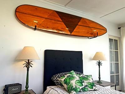 surfboard above fireplace